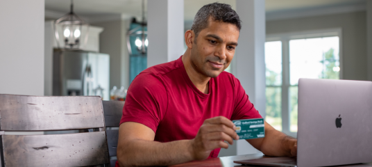 Man Using GSB Visa Debit Card