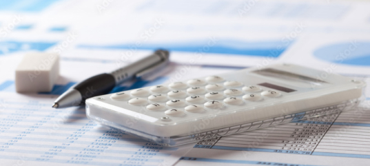 Woman Using Financial Calculators