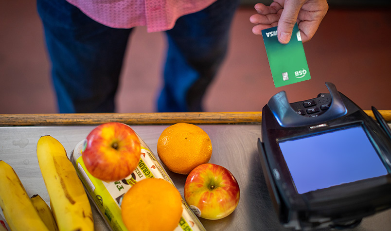 Customer buying food with a debit card