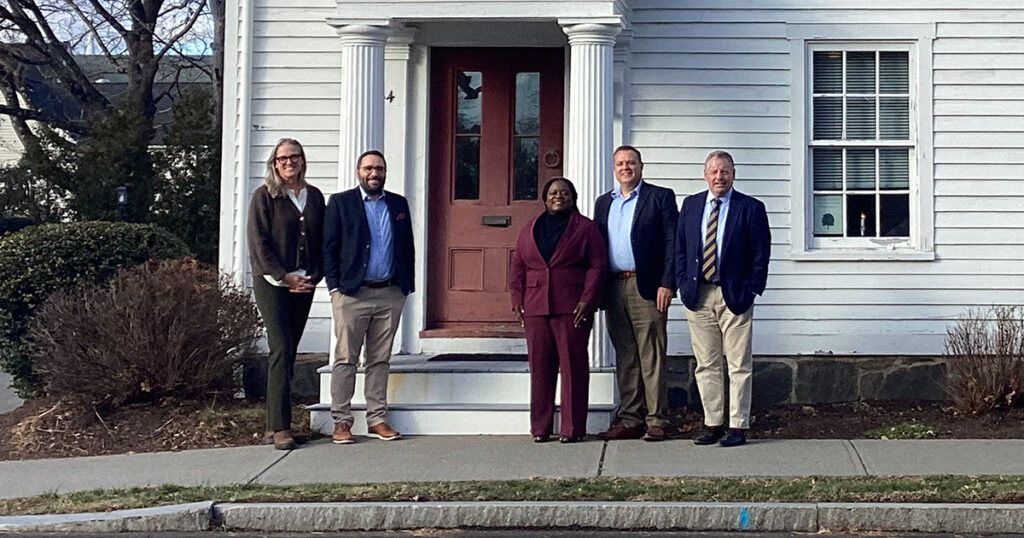 GSB and The Guilford Foundation in front of historic building