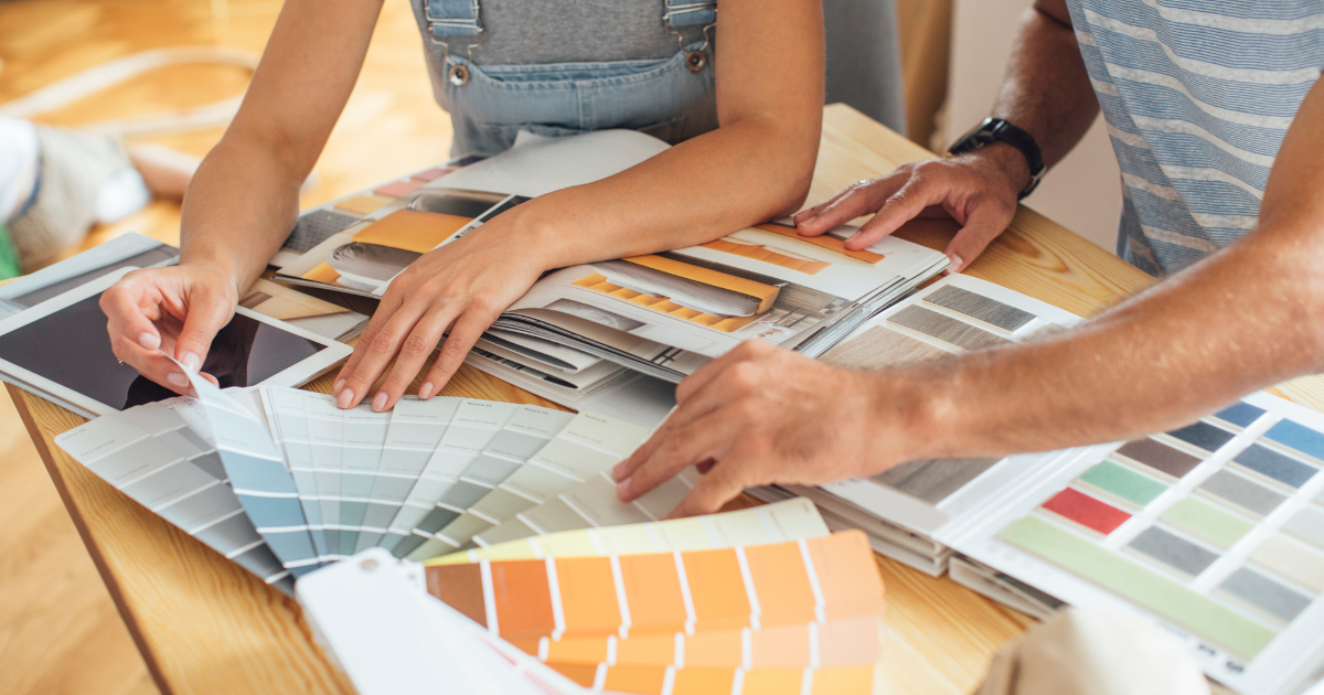 Couple searching through home design samples